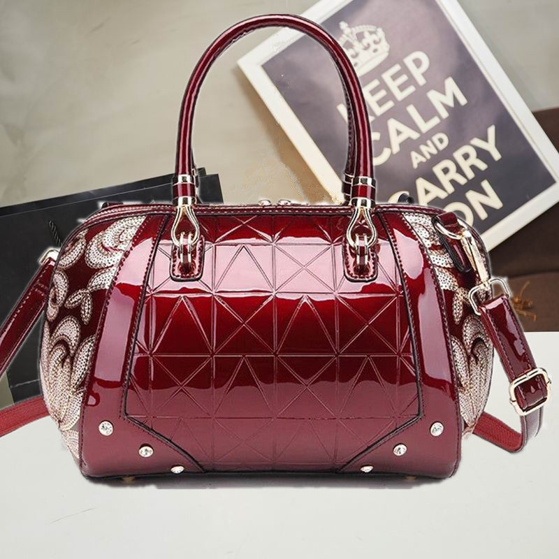 A burgundy Patent leather Boston handbag with a geometric pattern featuring a unique bag shape and fabric texture by Maramalive™.