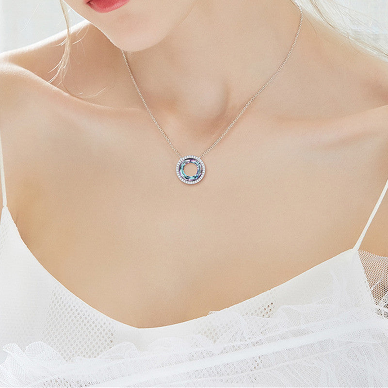 A woman wearing a Maramalive™ O.M.G. this is SOOO Beautiful Sterling Silver Geometric Pendant Necklace I Want It! with a blue and white heart.