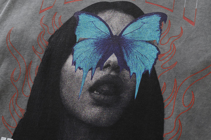 A grayscale image of a woman's face with a blue butterfly over her eyes and red flame designs in the background, printed on the Men's Dark Character Old Washed Long-sleeved T-shirt by Maramalive™, available in Asian sizes.
