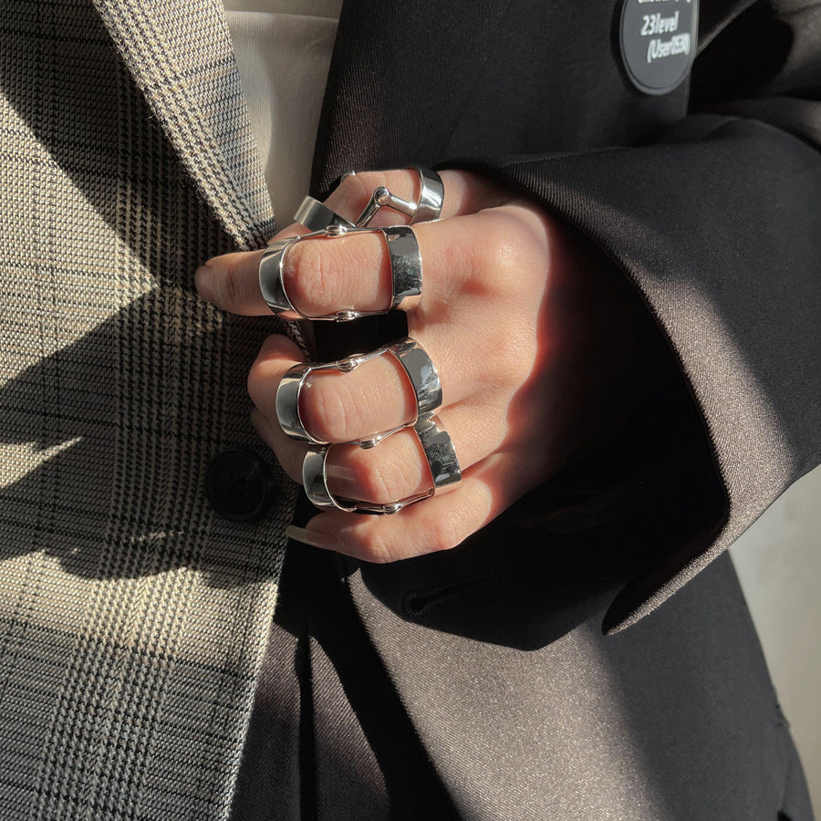 A woman wearing a black suit and a Gothic Metal Flex Ring by Maramalive™.