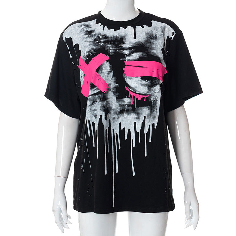 A black casual t-shirt with a draped design features a white and gray drip pattern and pink "X" marks over the chest area. The Chic Oversized Short Sleeve Tees for Women by Maramalive™ is displayed on a mannequin.
