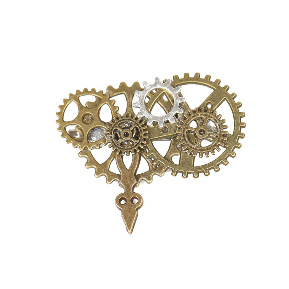 A group of three Maramalive™ Fashion Creative Steampunk Gear Wings Brooches sitting on top of a white table.