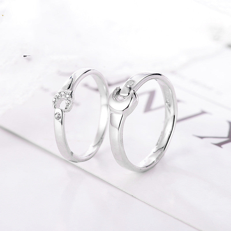 A Maramalive™ Couple Ring Jewelry with diamonds on it.
