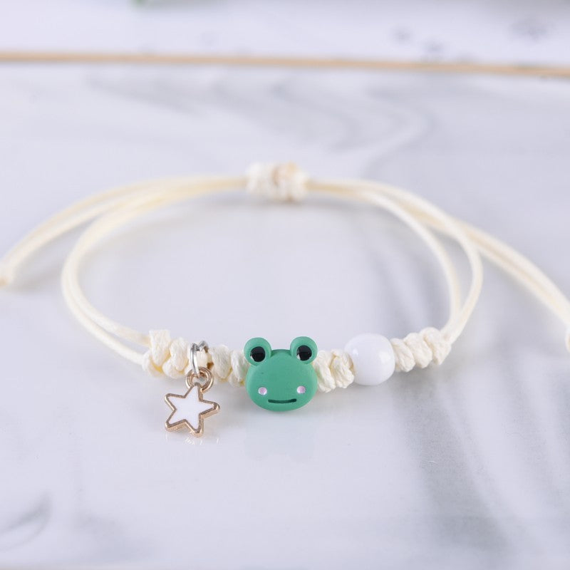 A yellow Simple Cute Frog Bracelet For Women with a frog charm on it from Maramalive™.