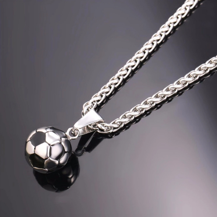 Two Stainless Steel World Cup Jewelry Pendant necklaces on a leather.