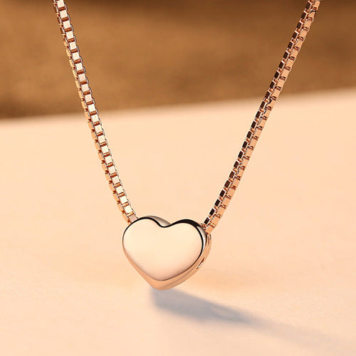 A small Minimalist Necklace from Maramalive™ on top of a table.