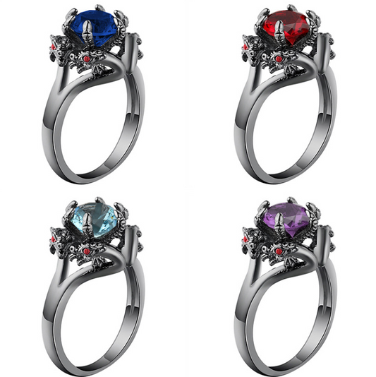 A set of four Tiamat Rings by Maramalive™ with different colored stones.