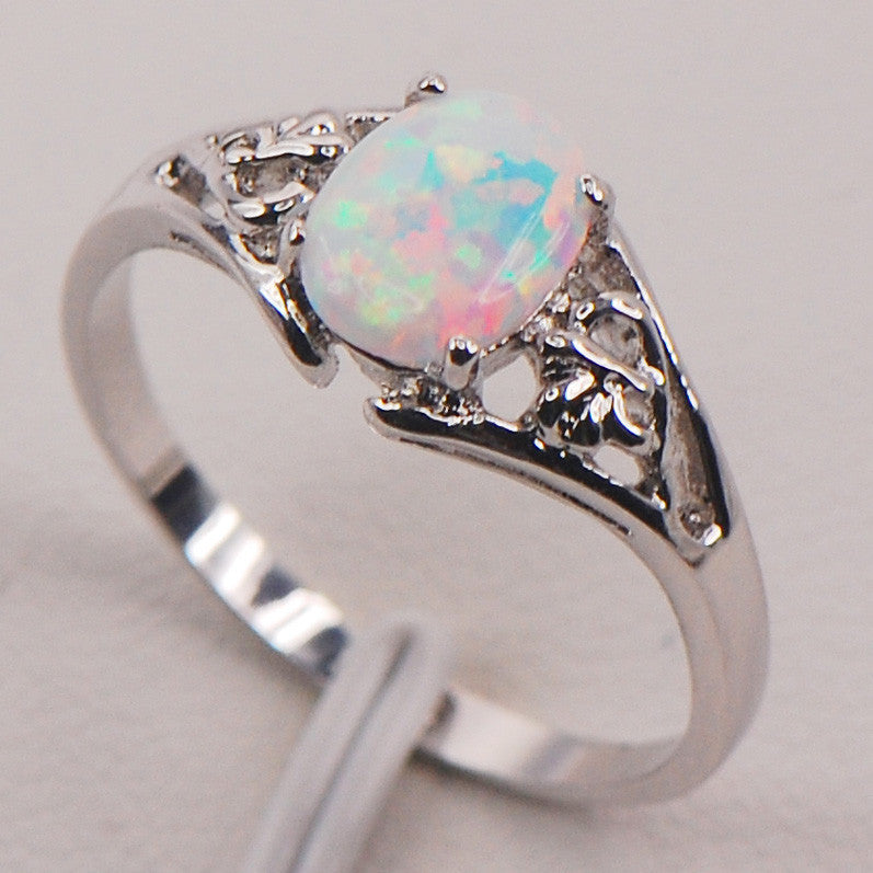 A Maramalive™ white opal ring on a white background.