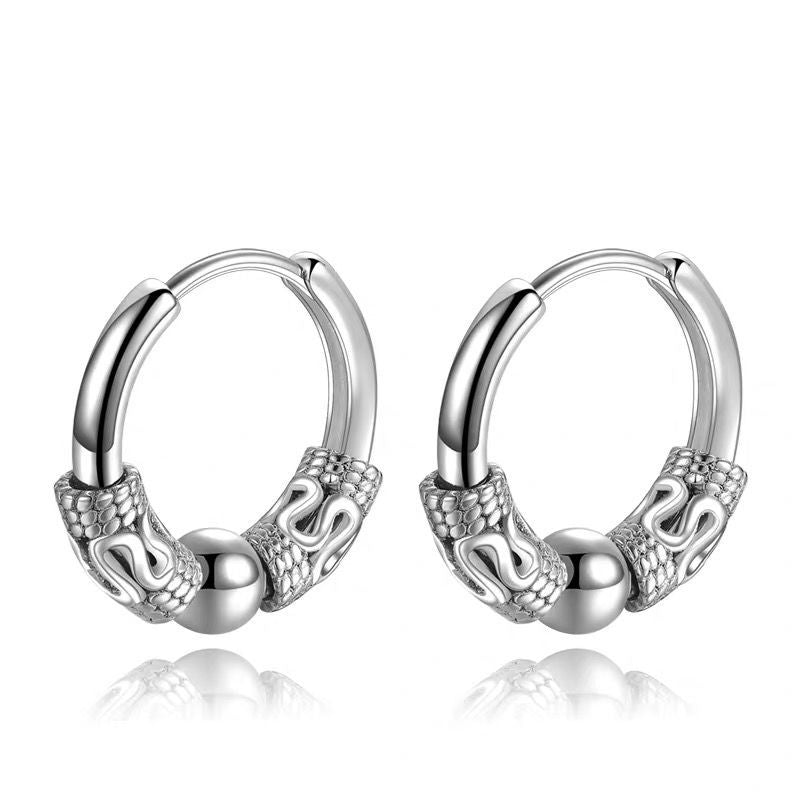 A pair of Dragon Totem Hoop Earrings - Men by Maramalive™ with skulls on them.