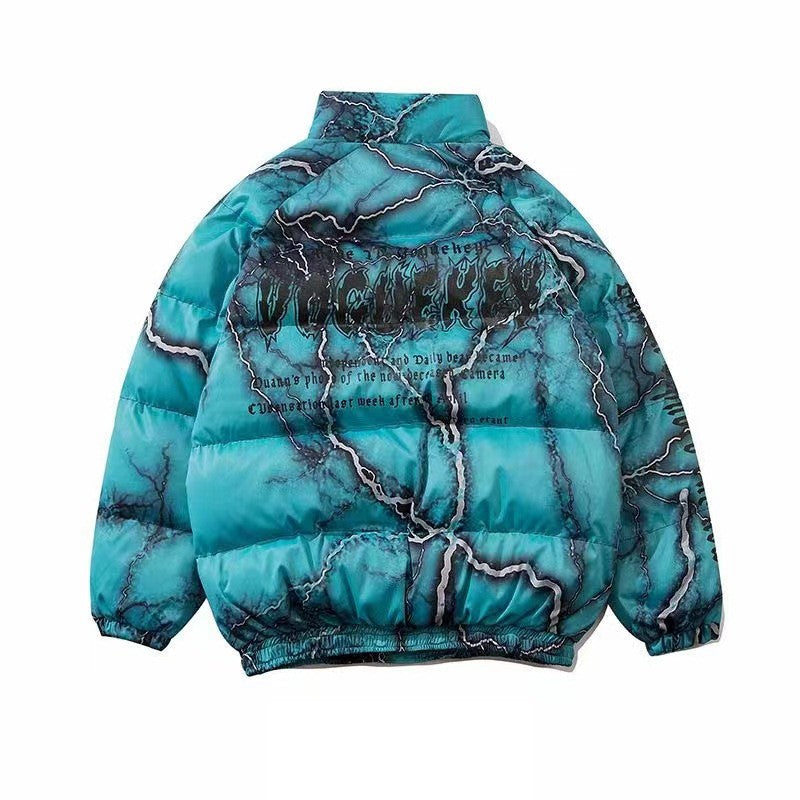 A blue marble-patterned puffer jacket with black and white text on the back. Featuring an oversized fit and dark graffiti printing, this high-collar, hip hop coat also has elastic cuffs for added style. The *Oversized Hip Hop Coat - Loose Fitting Urban Streetwear* by *Maramalive™* is a standout piece in any streetwear collection.