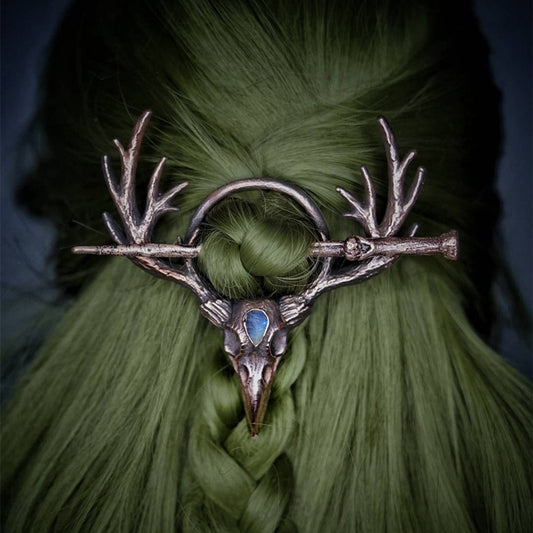 A spooky woman with a Twilight Talon - Gothic Retro Crow Skeleton Moonlight Stone Deer Horn Women's Hairpin by Maramalive™ on her head.