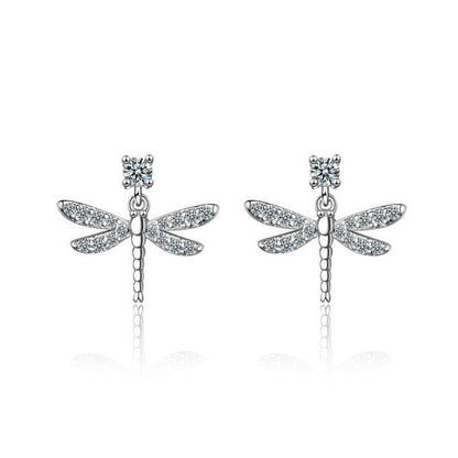 A pair of Maramalive™ Women's Dragonfly Diamond Earrings on a white plate.