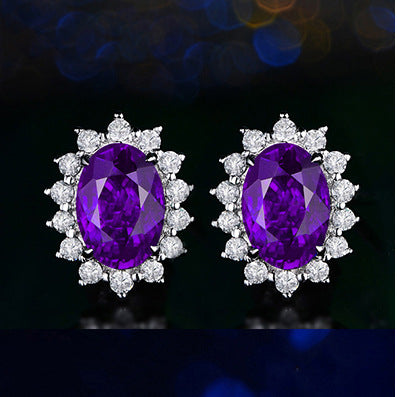 A pair of Versatile Crystal Earrings by Maramalive™, consisting of ruby and diamond studs.