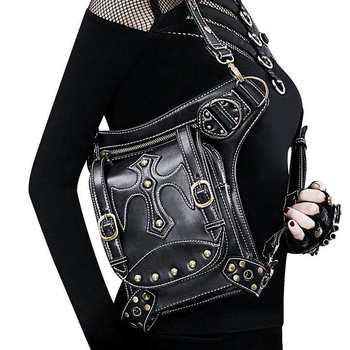 A woman is holding a black Maramalive™ Steampunk Victorian Vegan Friendly retro shoulder Multi-Purpose bag.