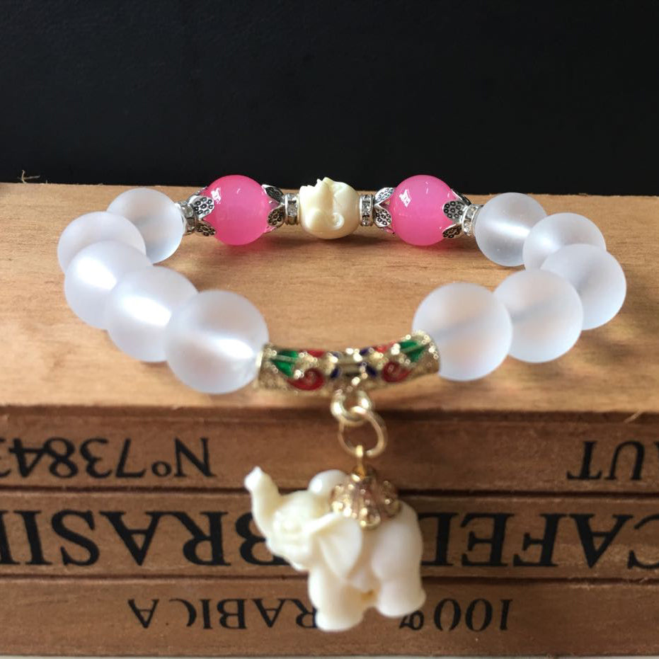 A Crystal Elephant Charm Bracelet with an elephant charm on it by Maramalive™.