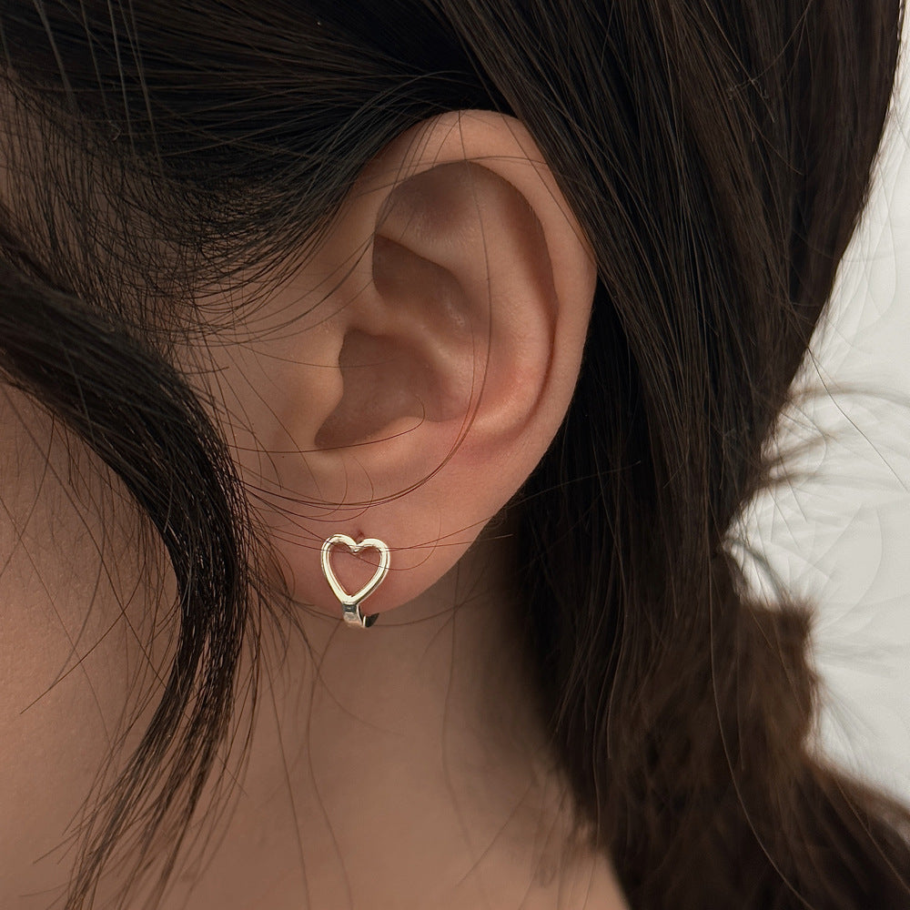 A woman's ear with a Minimalist Earrings by Maramalive™.