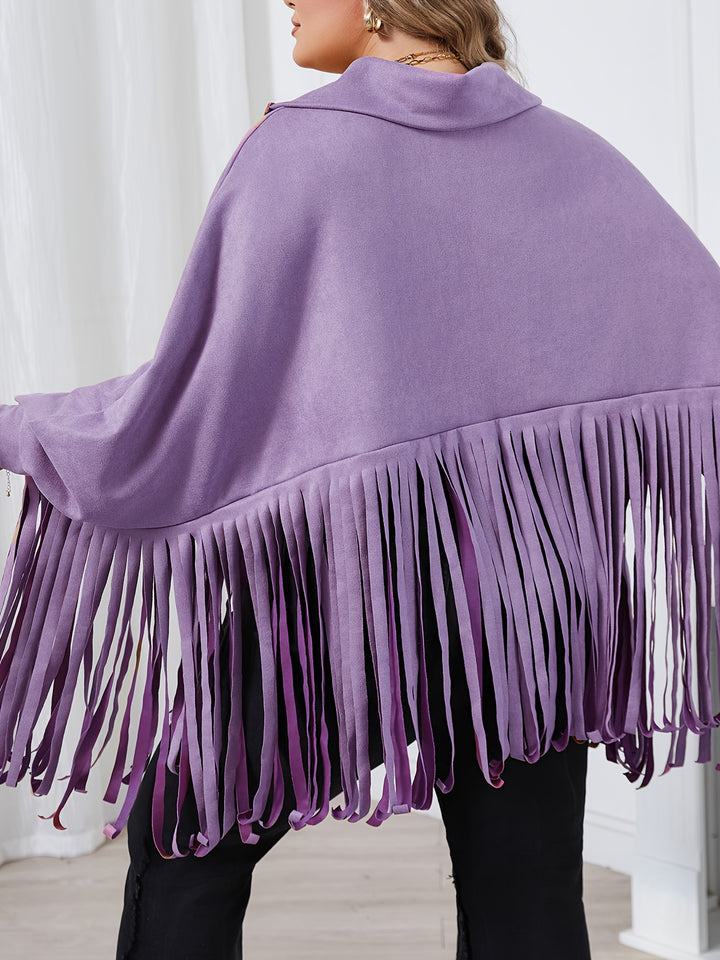 A person is wearing a lavender-colored fringed shawl with batwing sleeves, the back of which features long fringe details that extend to the waist, perfect for a cozy Fall/Winter look. The product is the Plus Size Trendy Top, Women's Plus Solid Batwing Sleeve Mock Neck Fringe Trim Cloak Top by Maramalive™.