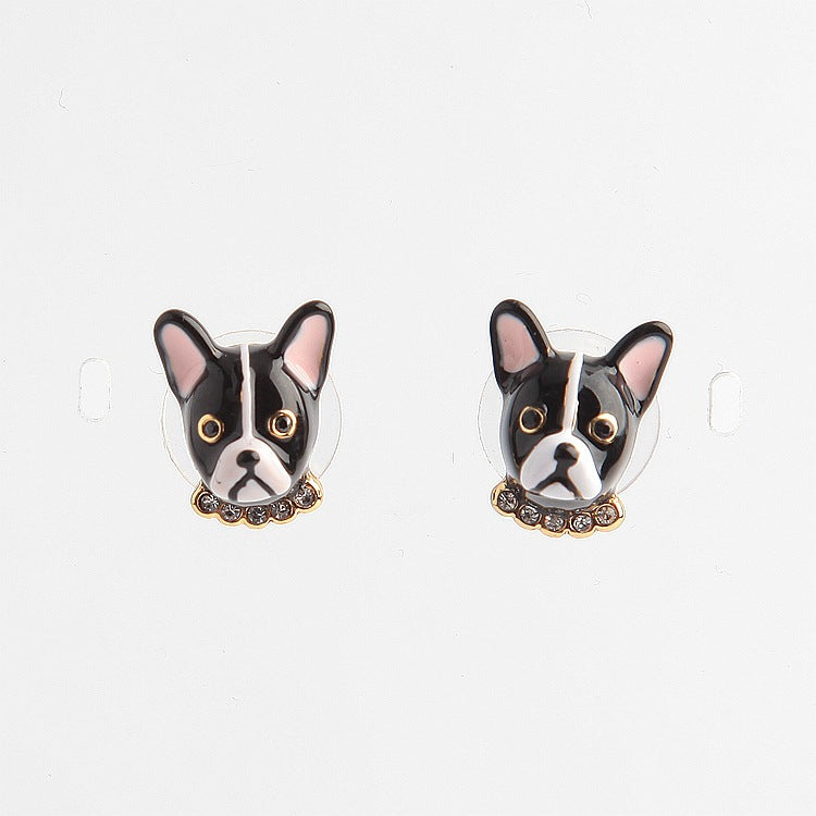 A pair of black and white Maramalive™ french bulldog stud earrings.