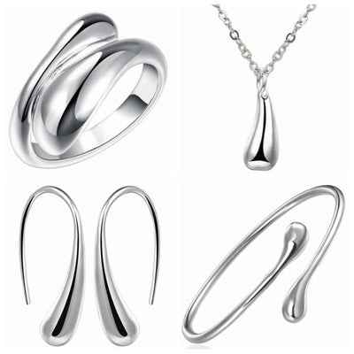A set of Amazingly Crafted Four-piece silver water drop earrings, necklace and ring by Maramalive™.