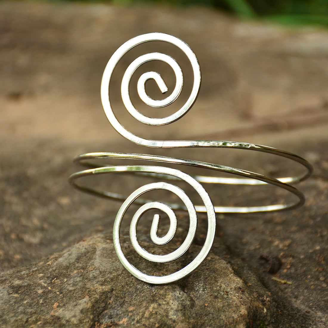 A woman's arm with an Eye-Catching Arm Ring Bracelet from Maramalive™.