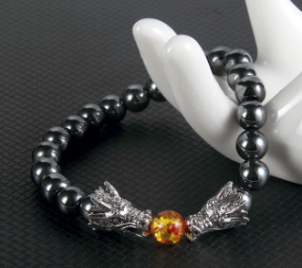 An Obsidian Double Dragon Bracelet with two dragon heads on it by Maramalive™.