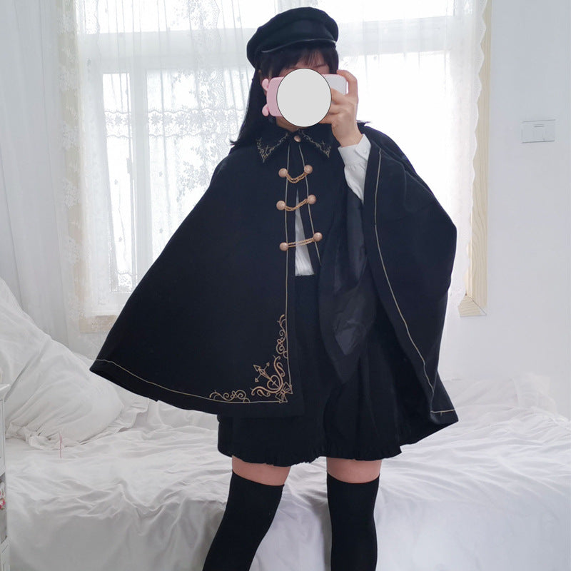 A girl in a Maramalive™ Japanese Style Soft And Hard Girl Cool Cos Role Lapel Dark Night Gothic Handsome Embroidered Swallowtail Woolen Cape Coat Coat taking a selfie.
