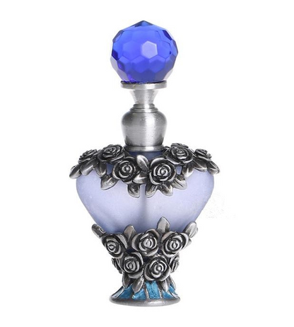 A Vintage Heart Shape Empty Refillable Metal Glass Maramalive™ Perfume Bottle Gift with roses on it.