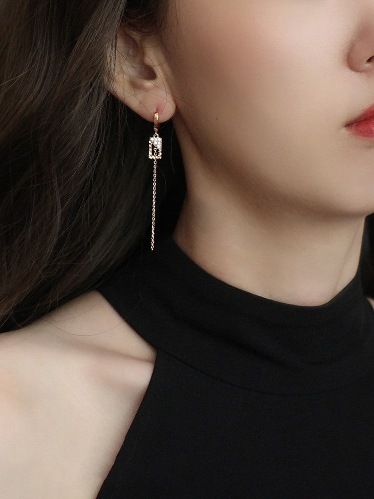 A pair of Geometric Square Long Earrings (Women's) with diamonds by Maramalive™.