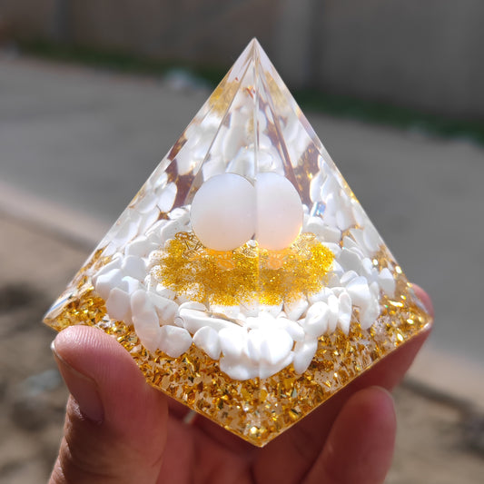 A hand holding a Home-Design Sense Store Home Crafts Resin Tabletop Ornament with a white egg inside of it.