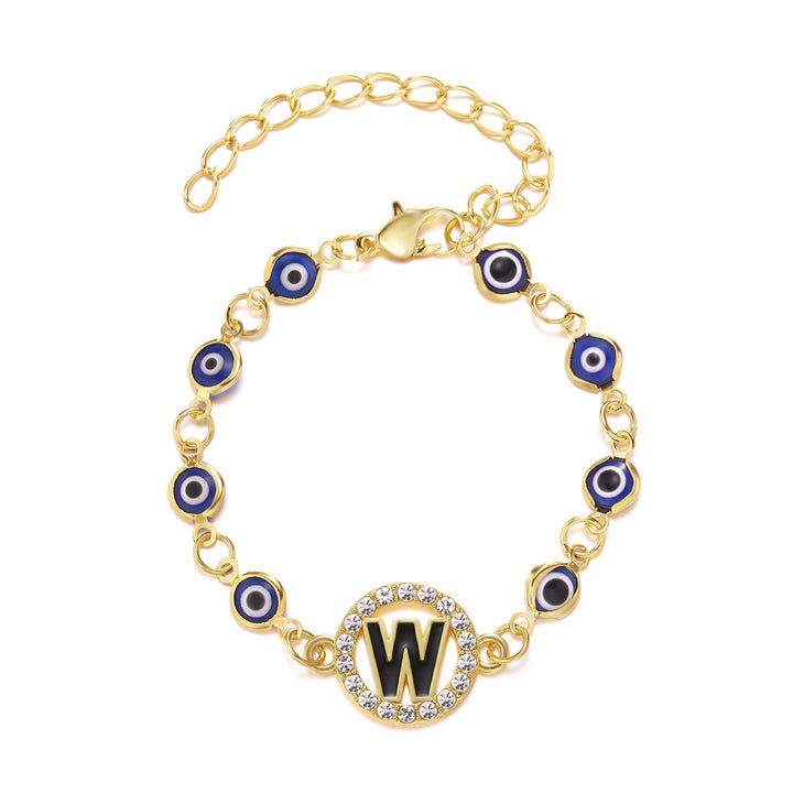 A woman wearing a Stunning Retro Blue Eyes Alloy Adjustable Bracelet for the Inquisitive by Maramalive™ with three evil eye charms.