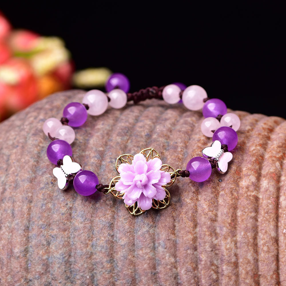 A Purple jade Flower crystal Beaded bracelet embellished with Butterfly Beads by Maramalive™.
