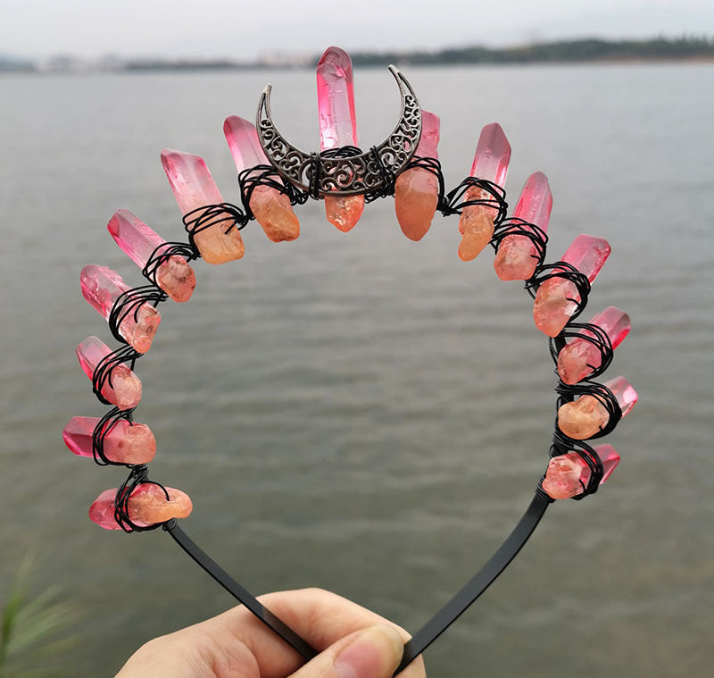 A person holding a Crystal Witch Headband with crystals on it. (Brand Name: Maramalive™)