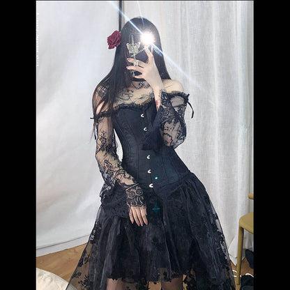 A woman in the Maramalive™ Dress to Rule the Dark Kingdom - Sinister Royalty Corset Gown and stockings.