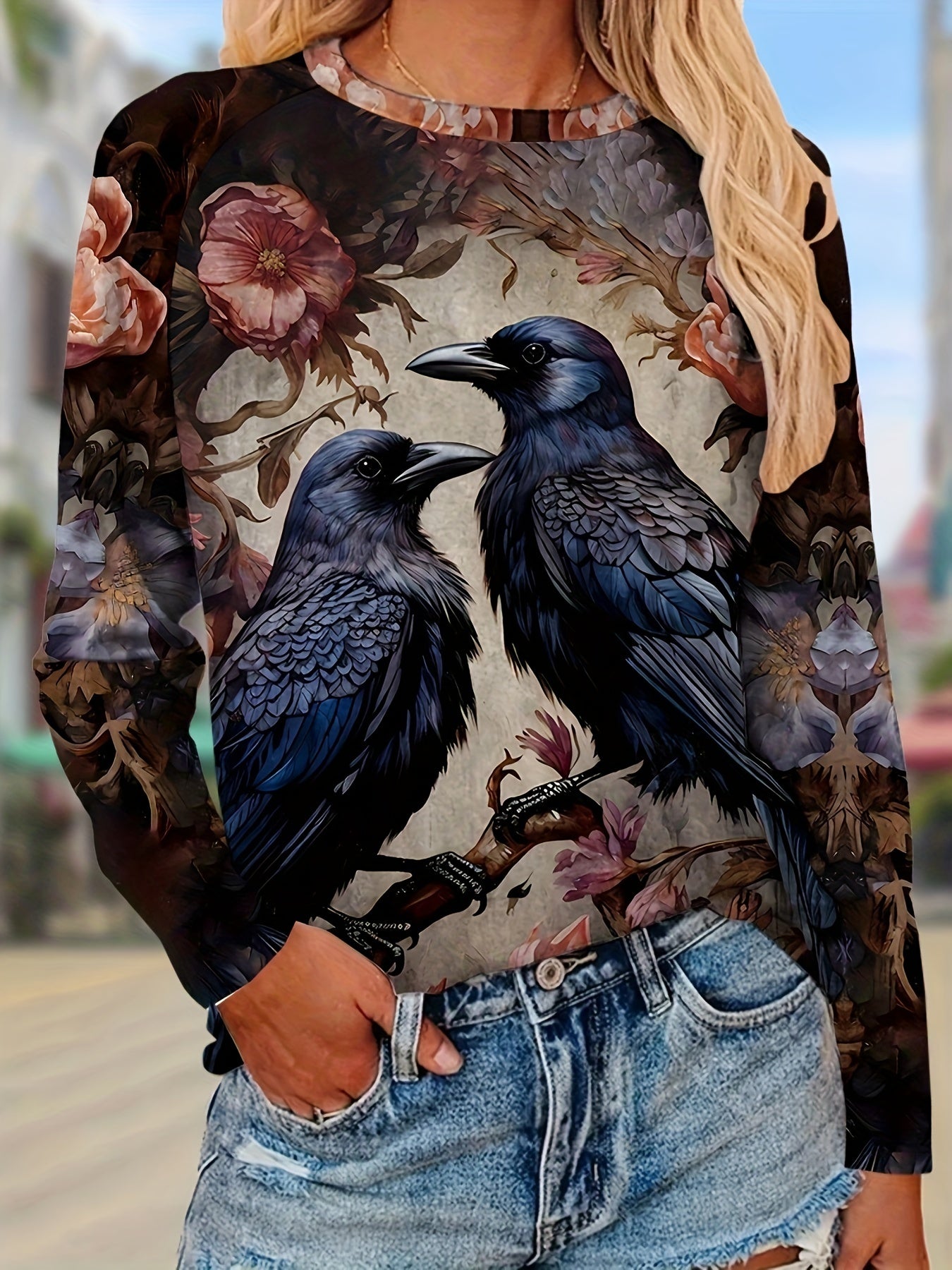 Person wearing a Maramalive™ Birds & Floral Print T-shirt, Vintage Crew Neck Long Sleeve T-shirt, Women's Clothing, paired with casual denim shorts.