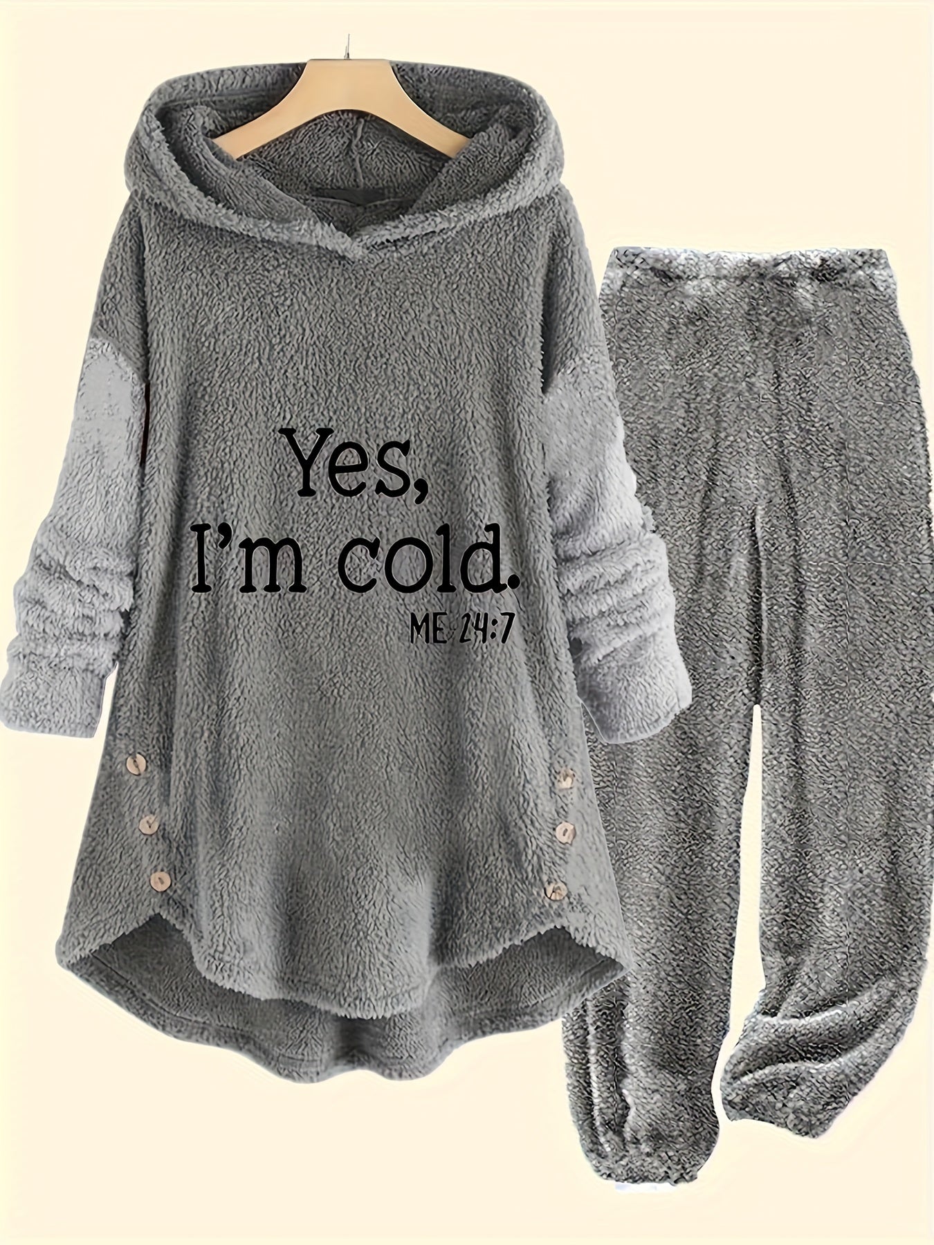 A Fuzzy Casual Two-piece Set, Letter Pattern Button Decor Hoodie & Pants Outfits, Women's Clothing from Maramalive™ with a long-sleeve hoodie featuring the text "Yes, I'm cold. ME 24:7" and cozy matching pants, crafted from soft polyester and displayed on a hanger against a plain background.
