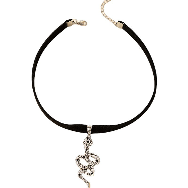 A woman wearing a Maramalive™ Velvet Gothic Choker Necklace with a snake pendant.