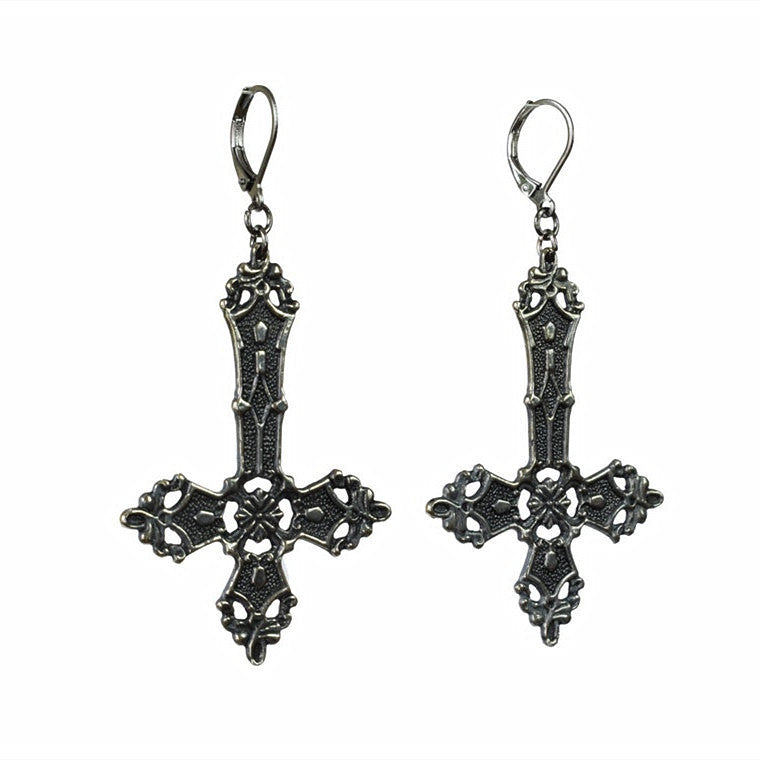 a close up of a person wearing CJ's Gothic Vintage Hollow Cross Earrings while holding a cell phone.