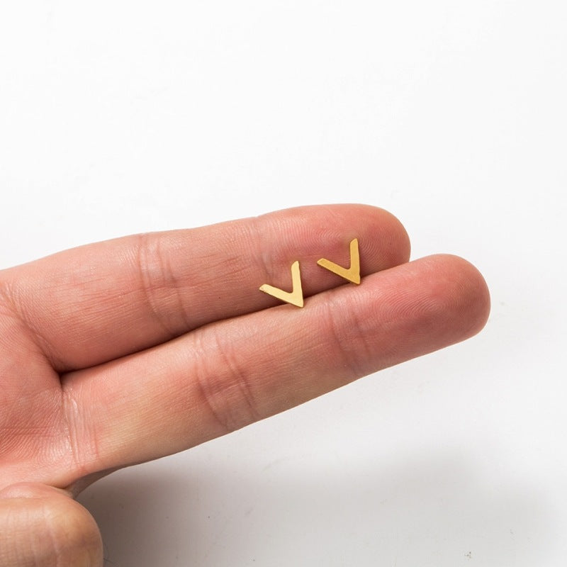 A pair of Minimalist Stainless Steel Earrings and a pair of Minimalist Stainless Steel Earrings on a black background.