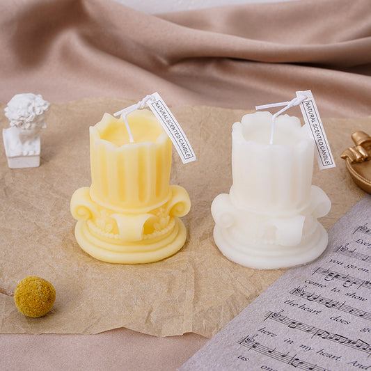 Two Maramalive™ Photography Props Home Decor scented candles sitting on top of a sheet of music.
