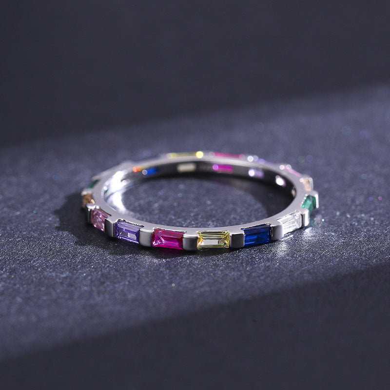 A woman's hand with a Maramalive™ 925 Silver Ring Geometric Rainbow Full Diamond Stackable on it.