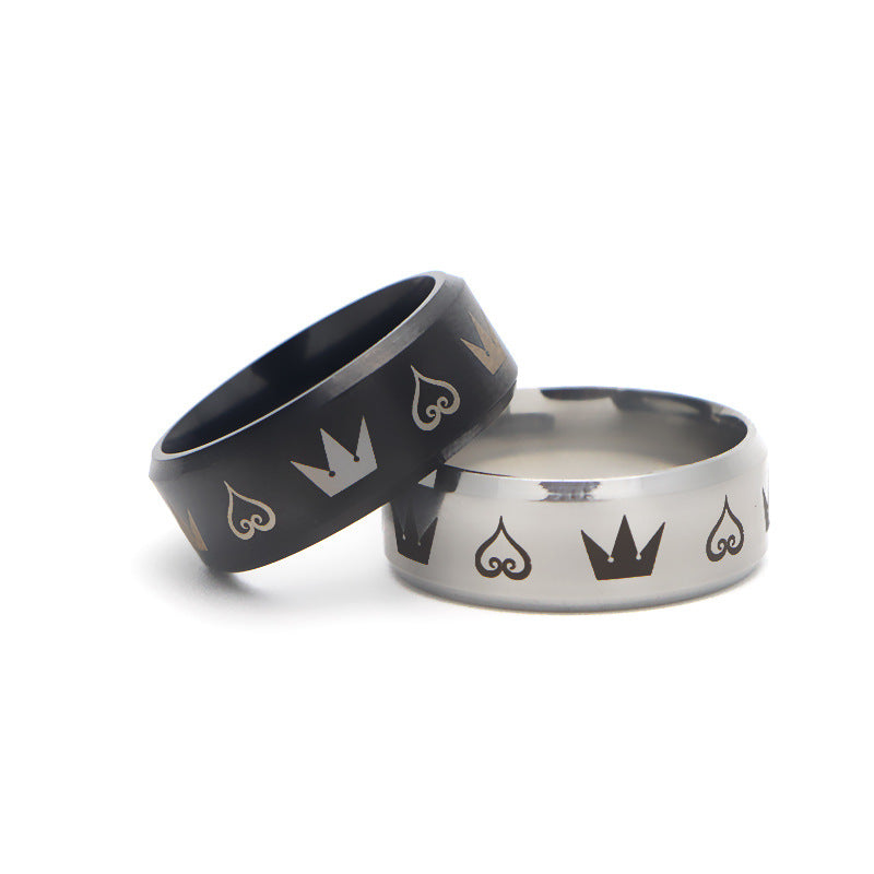 A man's hand is holding a Personality Trendy Hearts and Crowns Electroplated Ring with the brand name Maramalive™.