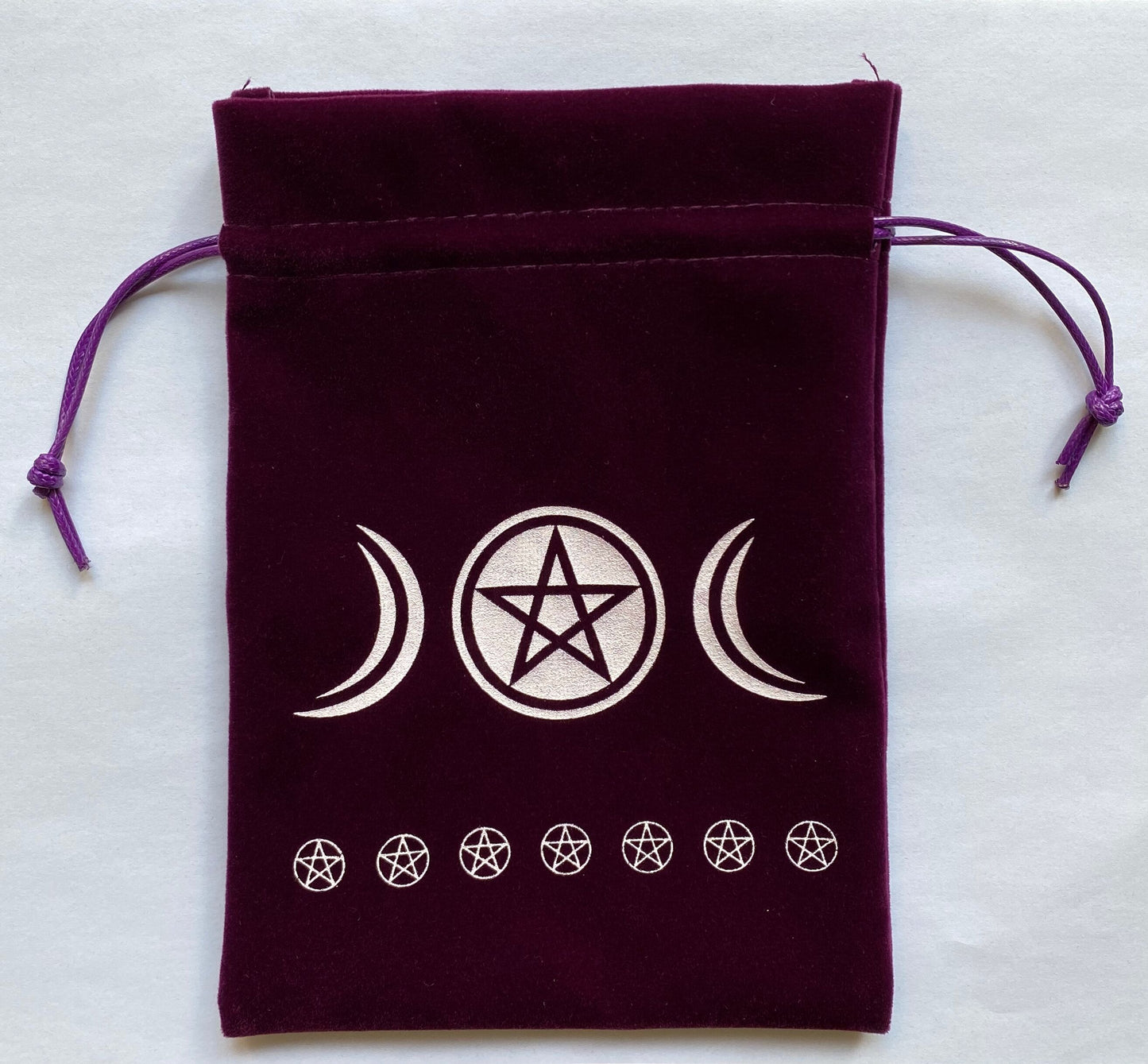 A black drawstring Tarot storage bag with three pentagrams on it, by Maramalive™.