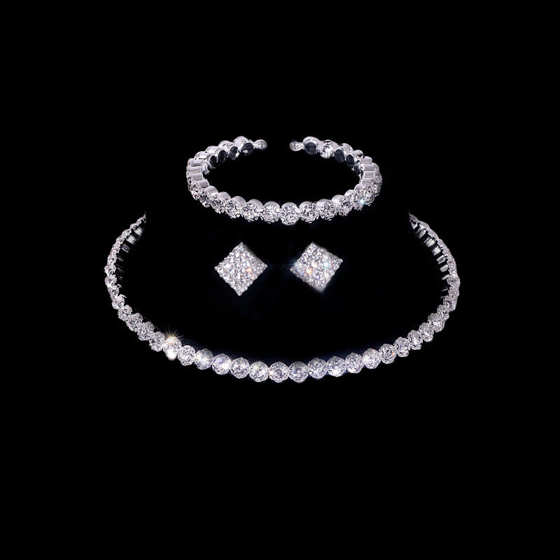 A Stunning Fashionable Diamanté Necklace Earrings Bracelet ring Set by Maramalive™ on a black background.