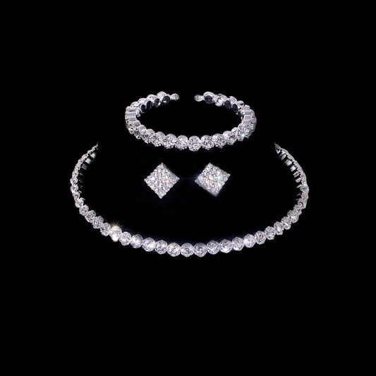 A Stunning Fashionable Diamanté Necklace Earrings Bracelet ring Set by Maramalive™ on a black background.
