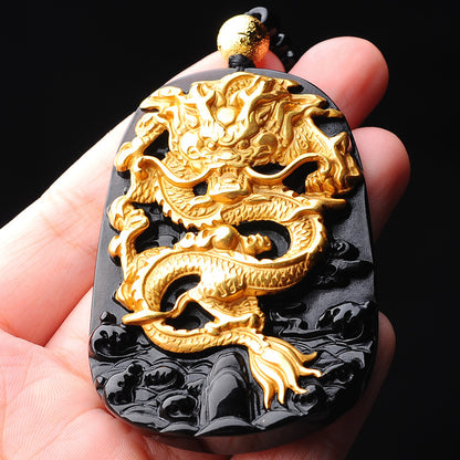 A black and gold Golden Dragon Pendant Necklace with a dragon on it, by Maramalive™.