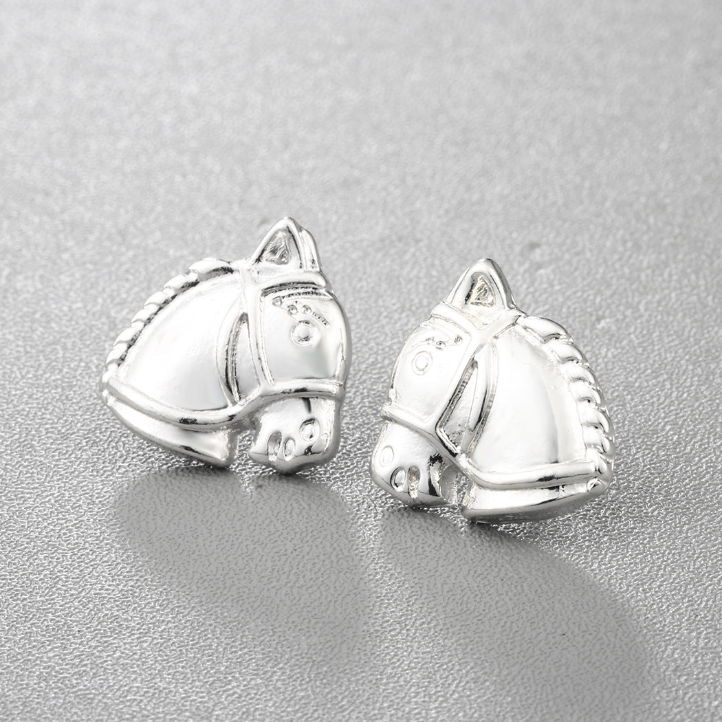 A pair of Maramalive™ Mini Horse Head stud earrings.