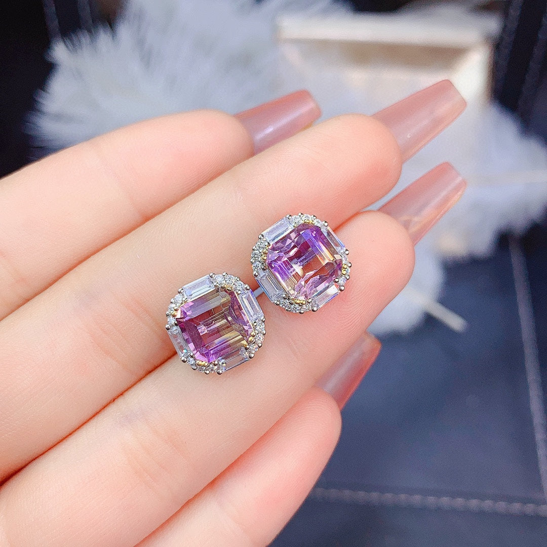A woman's hand holding the Ascher Amethyst Jewelry Set by Maramalive™.