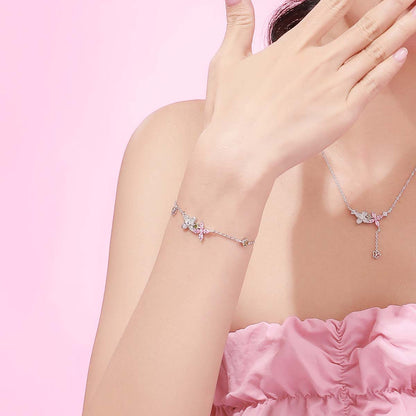A woman wearing a pink dress with a Women's Fashion Sterling Silver All-match Bracelet OH MY This is So Beautiful BLING! bracelet from the Maramalive™ brand.