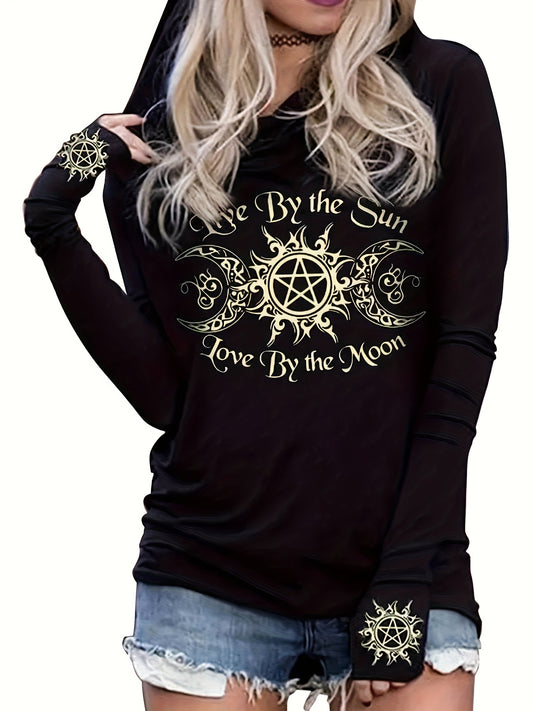 A person wearing a black Maramalive™ Gothic Graphic Print Hooded T-shirt, Casual Long Sleeve T-shirt For Spring & Fall, Women's Clothing that reads "Live By the Sun, Love By the Moon" along with decorative symbols on the front. They are also sporting denim shorts for a casual fit. The outfit is machine washable.