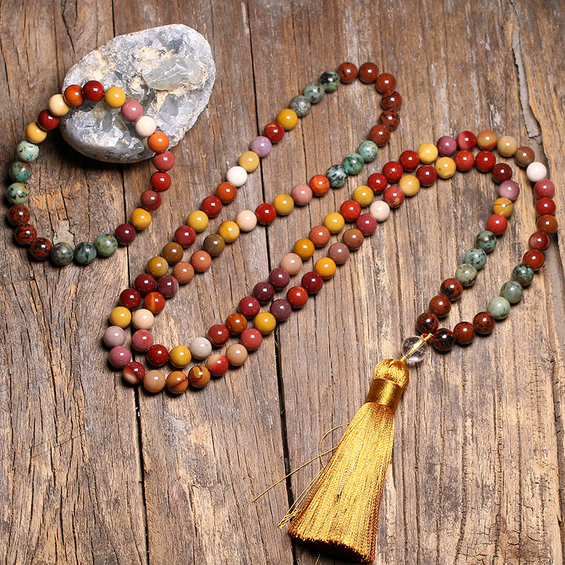 A Maramalive™ Natural Stone 8MM108 Jewelry Set Lapis Lazuli Jewelry necklace and bracelet on a wooden table.